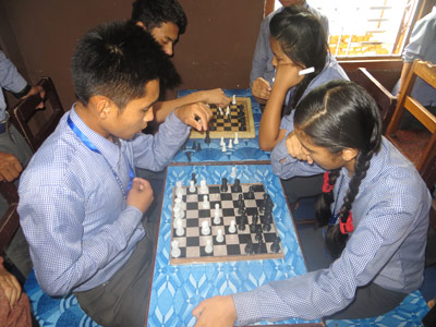 Nepali students playing chess at National Bethel Academy